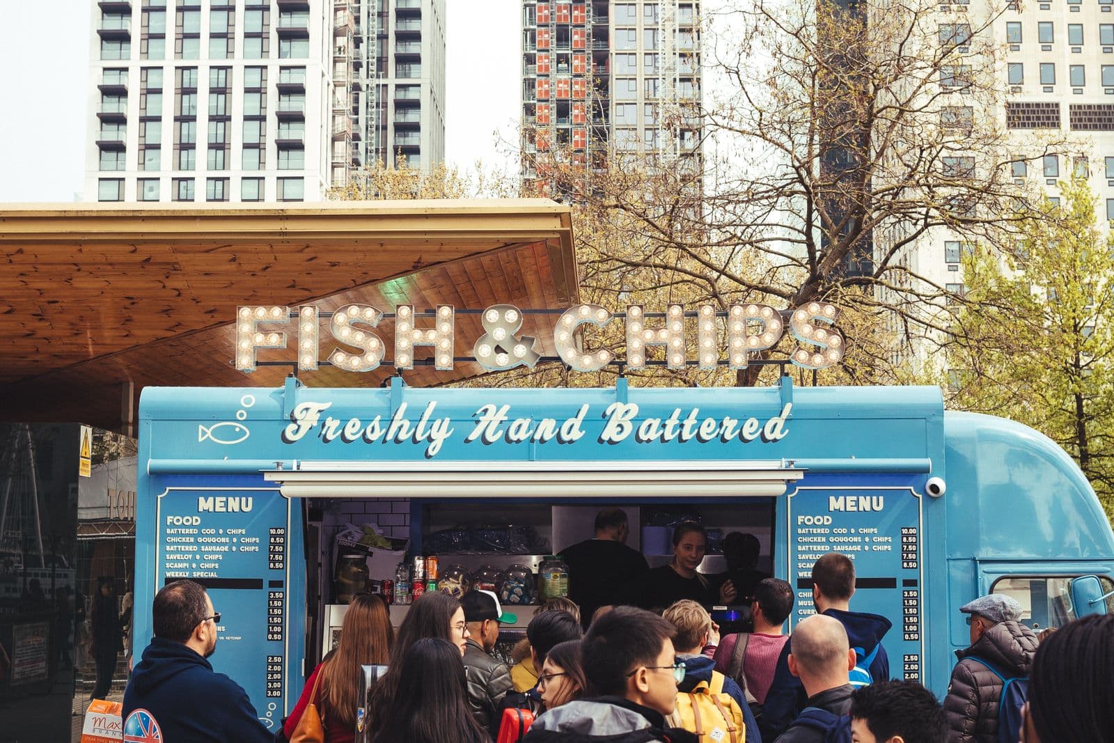 Fish and chips van trading with customers at the hatch