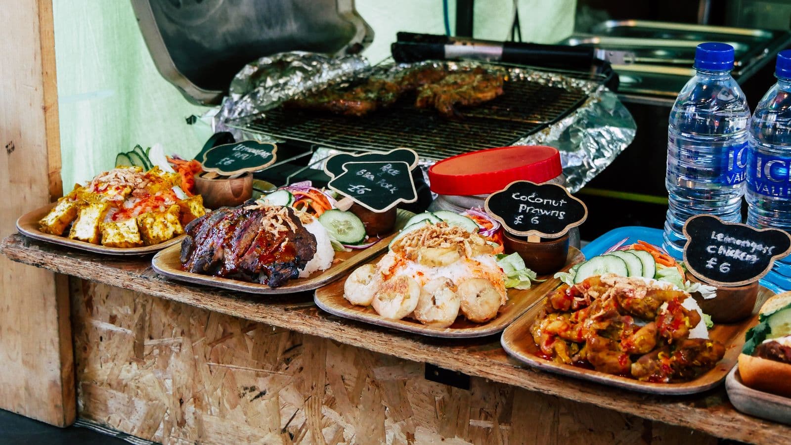 Street food stall menu boards and prepared dishes
