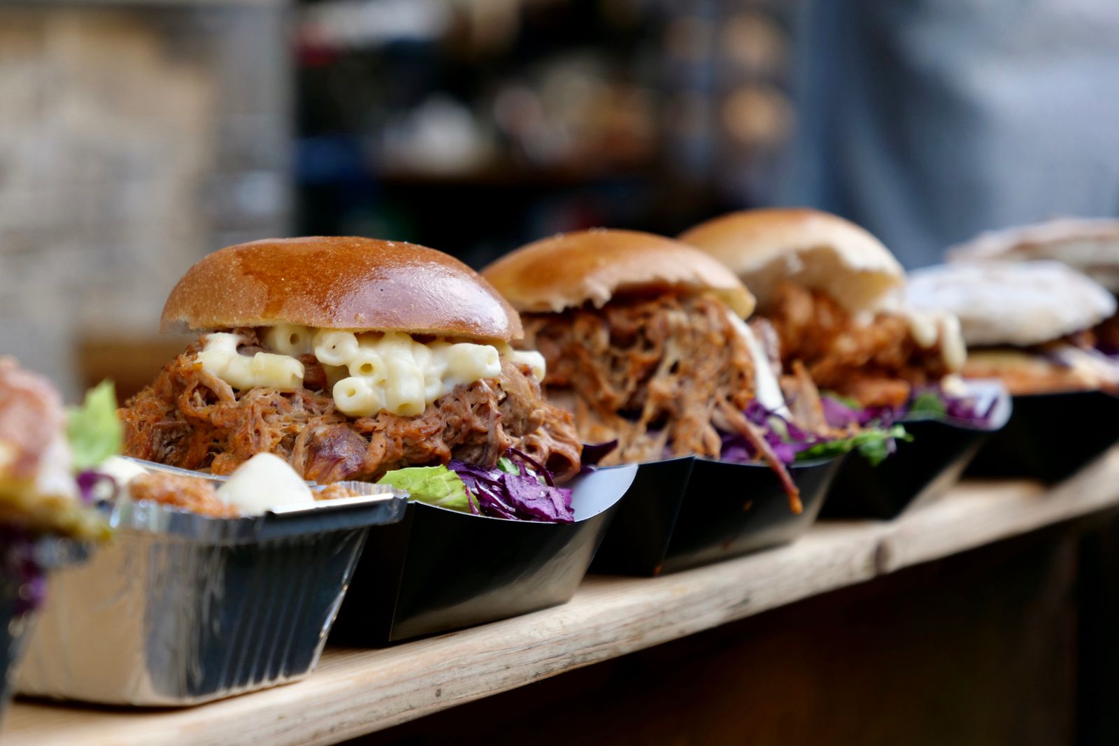 Pulled pork buns in trays at a food truck